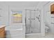 Clean bathroom featuring a walk-in shower, soaking tub and private toilet at 7538 E Forge Ave, Mesa, AZ 85208