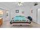 Serene primary bedroom with natural light, a ceiling fan, and calm decor at 7538 E Forge Ave, Mesa, AZ 85208