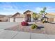 Attractive home boasting a 3-car garage, desert landscaping, and welcoming curb appeal at 7538 E Forge Ave, Mesa, AZ 85208