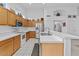 A well-equipped kitchen with light wood cabinets, stainless steel appliances, and ample counter space at 7538 E Forge Ave, Mesa, AZ 85208