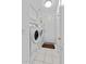 Clean, white laundry room equipped with a washer, dryer, and storage cabinets at 7538 E Forge Ave, Mesa, AZ 85208