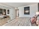 This bedroom features a neutral color palette, modern art and large mirrored closet at 7601 E 2Nd St # 20, Scottsdale, AZ 85251