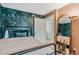This bedroom features a wallpapered accent wall and neutral-colored walls, creating a serene and stylish atmosphere at 7601 E 2Nd St # 20, Scottsdale, AZ 85251