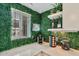 Unique kitchenette featuring decorative green wall, bright lighting, a coffee station, and a wine rack at 7601 E 2Nd St # 20, Scottsdale, AZ 85251