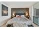 Elegant main bedroom featuring decorative wallpaper, soft lighting, a cozy bed, and stylish decor at 7601 E 2Nd St # 20, Scottsdale, AZ 85251