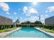 A sparkling swimming pool surrounded by lush greenery and comfortable lounge chairs at 7601 E 2Nd St # 20, Scottsdale, AZ 85251