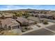 Aerial view of a residential neighborhood with well-maintained homes and mountain views at 8003 S 69Th Dr, Laveen, AZ 85339