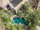 Aerial view of a backyard showcasing a private pool surrounded by trees, creating a secluded and serene retreat at 802 N Butte Ave, Chandler, AZ 85226