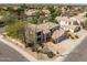 Stunning aerial view of a spacious home featuring a well-manicured yard, mature trees, and a tile roof at 802 N Butte Ave, Chandler, AZ 85226