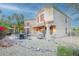 Backyard with a rock garden, outdoor seating, BBQ grill, and partial fencing surrounding the area at 802 N Butte Ave, Chandler, AZ 85226
