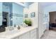 Bathroom featuring white cabinets, vanity sink, and decorative elements to complement the blue walls at 802 N Butte Ave, Chandler, AZ 85226