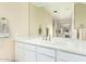 Well-lit bathroom featuring a large mirror, white cabinets, and tile flooring at 802 N Butte Ave, Chandler, AZ 85226