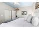Bedroom with a white bed, carpet flooring, ceiling fan, and a closet with sliding doors at 802 N Butte Ave, Chandler, AZ 85226