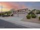 Side view of the beige two-story house showing the three car garage at 802 N Butte Ave, Chandler, AZ 85226