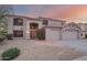 Charming two-story home featuring a three car garage and desert landscaping at 802 N Butte Ave, Chandler, AZ 85226