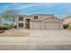 Charming two-story home featuring a three car garage, desert landscaping, and tile roof at 802 N Butte Ave, Chandler, AZ 85226