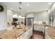 A spacious kitchen featuring custom white cabinets, stainless appliances, and granite countertops at 802 N Butte Ave, Chandler, AZ 85226