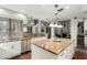 Spacious kitchen featuring granite countertops, stainless steel appliances, and a breakfast bar overlooking the living space at 802 N Butte Ave, Chandler, AZ 85226
