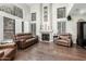 Spacious living room with high ceilings, ample natural light, and a cozy fireplace at 802 N Butte Ave, Chandler, AZ 85226