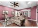 Living room with hardwood floors, ceiling fan, and view into the dining room at 802 N Butte Ave, Chandler, AZ 85226