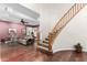The living room leads to a curved staircase with wood banister at 802 N Butte Ave, Chandler, AZ 85226