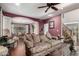 Open-concept living room with hardwood floors, a classic archway, and traditional furnishings at 802 N Butte Ave, Chandler, AZ 85226