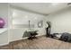 Open loft area featuring carpet flooring and a variety of exercise equipment at 802 N Butte Ave, Chandler, AZ 85226