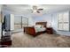 Charming main bedroom with carpet, ceiling fan and plenty of natural light from the windows at 802 N Butte Ave, Chandler, AZ 85226
