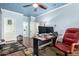 Home office featuring hardwood floors, blue walls, ample desk space, and a comfortable work environment at 802 N Butte Ave, Chandler, AZ 85226