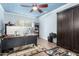 Home office with blue walls, ceiling fan, carpet flooring, and ample desk space at 802 N Butte Ave, Chandler, AZ 85226