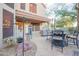 Cozy outdoor patio featuring stone flooring, wrought iron furniture, and a built-in barbecue, perfect for entertaining at 802 N Butte Ave, Chandler, AZ 85226