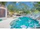 Inviting backyard pool with rock features, clean blue water, and ample space for relaxation and recreation at 802 N Butte Ave, Chandler, AZ 85226