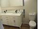 Bright bathroom showcasing a double sink vanity and modern fixtures at 8219 N 59Th Ave, Glendale, AZ 85302