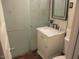 Bathroom with vanity, marble countertop, toilet, and tile shower at 8219 N 59Th Ave, Glendale, AZ 85302