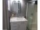 Remodeled bathroom with marble countertop and tiled backsplash, plus walk-in shower at 8219 N 59Th Ave, Glendale, AZ 85302