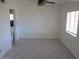 Room with white walls, a ceiling fan, and tile flooring at 8219 N 59Th Ave, Glendale, AZ 85302