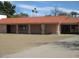View of the house with a red tile roof and beige exterior walls at 8219 N 59Th Ave, Glendale, AZ 85302