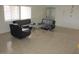 Living room with ample natural light, tile flooring, and modern furniture at 8219 N 59Th Ave, Glendale, AZ 85302