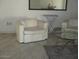 Clean living room with modern chairs and marble floors at 8219 N 59Th Ave, Glendale, AZ 85302