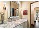 Well-lit bathroom featuring a granite countertop, ample mirror space, and neutral color tones at 8306 N Merion Way, Paradise Valley, AZ 85253
