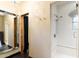 Bathroom with a glass-enclosed shower featuring sleek fixtures and clean lines, next to a mirrored vanity area at 8306 N Merion Way, Paradise Valley, AZ 85253