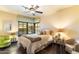 Cozy bedroom with a bright bay window and a mix of modern and classic decor at 8306 N Merion Way, Paradise Valley, AZ 85253