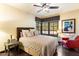 Serene bedroom with natural light, a plush bed, and stylish accents, exuding comfort and charm at 8306 N Merion Way, Paradise Valley, AZ 85253