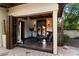An airy exercise room featuring an open design, dark floors, and mirrored wall at 8306 N Merion Way, Paradise Valley, AZ 85253