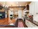 Elegant kitchen features custom white cabinetry, stainless steel appliances, and a large wood-topped island with a sink at 8306 N Merion Way, Paradise Valley, AZ 85253