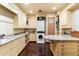 Bright laundry room with cream-colored cabinets, granite countertops, ample storage, and modern washer and dryer at 8306 N Merion Way, Paradise Valley, AZ 85253