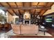 Inviting living room with fireplace, built-in bookshelves, and an elegant dining area, perfect for entertaining guests at 8306 N Merion Way, Paradise Valley, AZ 85253
