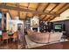 Elegant living room featuring a fireplace, custom built-ins, a wood beam ceiling, and stylish seating at 8306 N Merion Way, Paradise Valley, AZ 85253