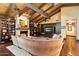 Living room boasts a cozy fireplace, built-in bookshelves, and an inviting atmosphere with exposed ceiling beams at 8306 N Merion Way, Paradise Valley, AZ 85253