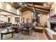 Bright living room with high ceilings, exposed beams, and a large fireplace for relaxation and social gatherings at 8306 N Merion Way, Paradise Valley, AZ 85253